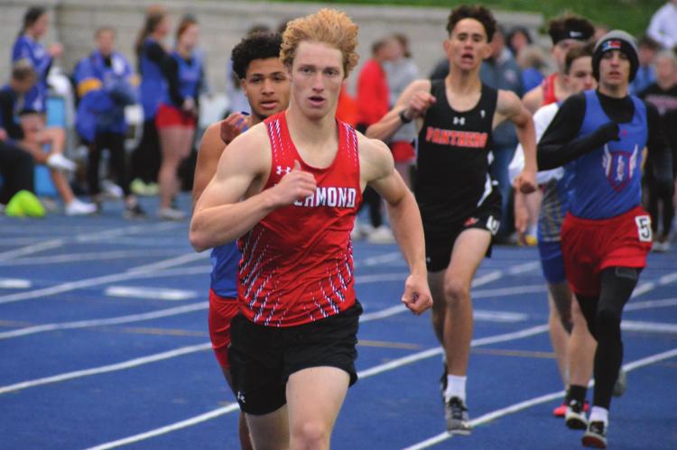 SENIOR EVAN VANDIVER sets the pace for the boys 800-meter run Tuesday during the Missouri River Valley Conference East Division track and field championships at Lafayette County of Higginsville. SHAWN RONEY | Staff