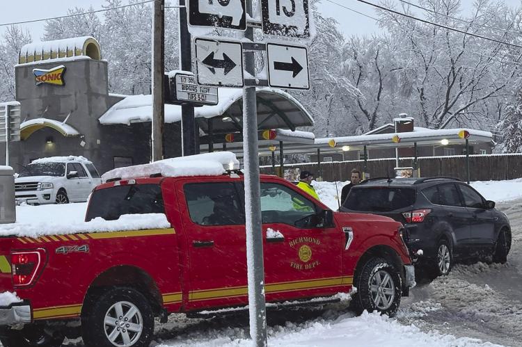 FIRE CHIEF Mark Sowder talks to the driver of a vehicle experiencing problems getting up the slight incline in front of Sonic. ROBBIE FARABEE | Submitted