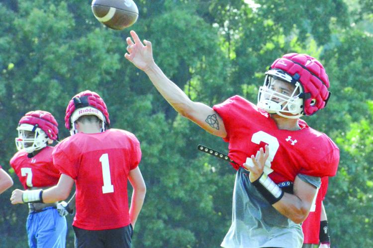 QUARTERBACK DONIVIN WILLIAMS throws to Richmond’s receivers as the Spartans train Aug. 12 on their practice field to prep for the season, set to begin Saturday against New Madrid County Central in St. Genevieve. SHAWN RONEY | Staff
