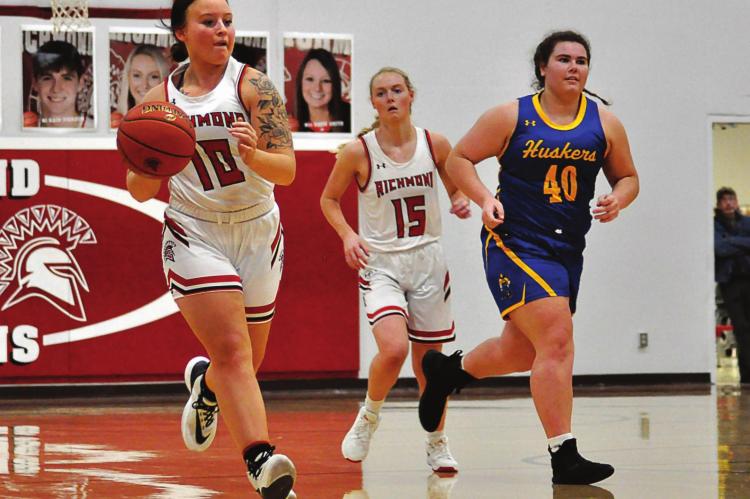 SSKYLAR QUICK pushes the ball for Richmond Tuesday in her last game on her home basketball court. HAWN RONEY | Richmond News