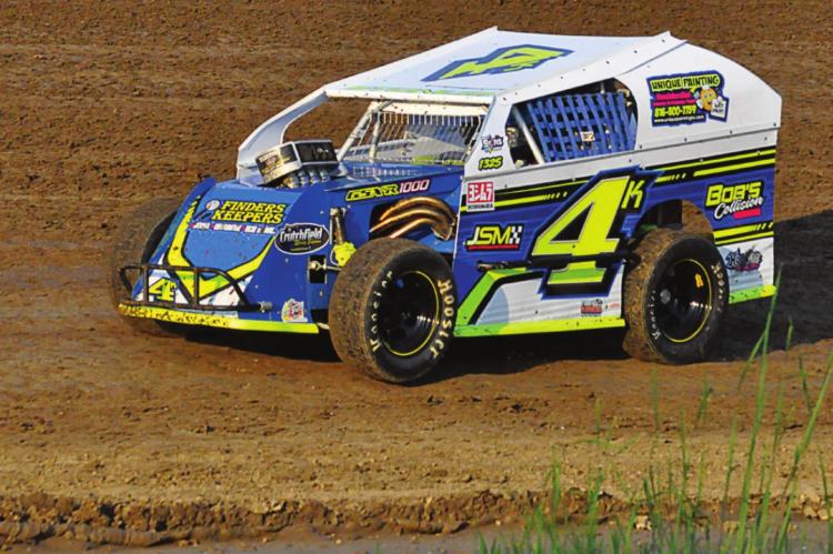 GARRET STONUM of Lawson speeds along during his heat race in the IMCA stars mod lite class July 3 at Valley Speedway.