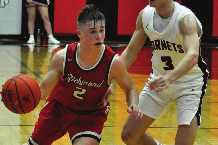 JUNIOR LAYNE CAVANAH, seen dribbling here during the Class 3 District * title game against Chillicothe, is among the guards who will be call upon to fill the void for Richmond left by the graduation of Dionte Marquez. SHAWN RONEY | Staff