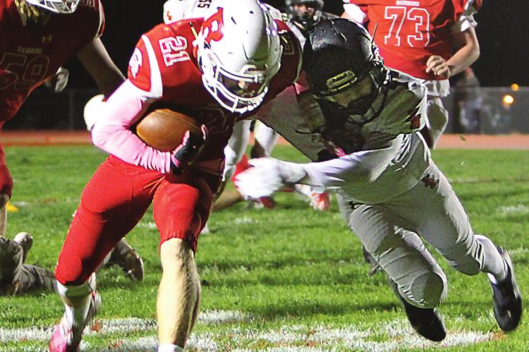 WITH THE PANTHERS in striking distance in a 20-12 game, senior running back Evan Vandiver carries to the 3, but penalties send the ball back to the 34. Later, at the 23, quarterback Keyshaun Elliott tosses a TD pass to junior wideout Trevin Quick. Senior running back Aidan Ivison’s conversion puts the Spartans up 28-12, all they need to win. J.C. VENTIMIGLIA | Staff