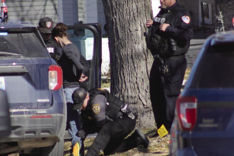 SOPHIA BALES | Staff JESSICA ARRINGTON is handcuffed and searched by Ray County Sheriff’s Deputy Kearia Railey.