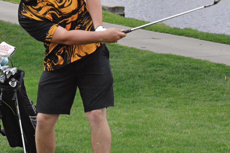 SENIOR TRENT WINDSOR follows through on a shot during Orrick’s boys golf dual with Faith Christian Academy. SHAWN RONEY | Staff
