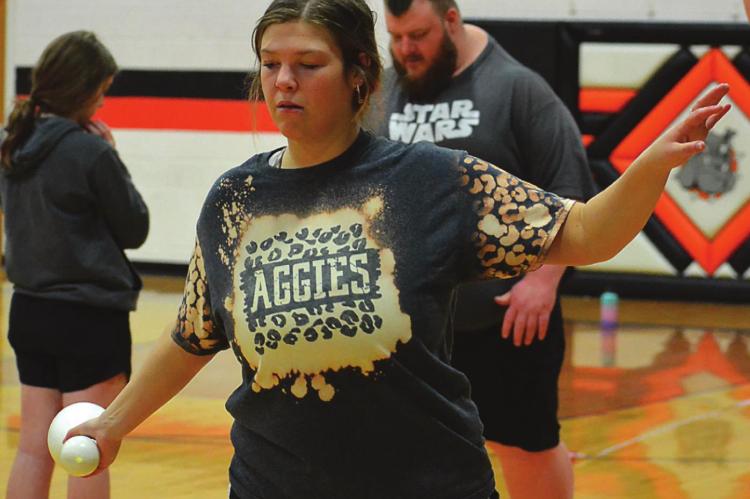 USING A bowling pin, Hardin-Central senior Abby McNelly works on her discus technique March 7 in the Hardin-Central gym. SHAWN RONEY | Staff