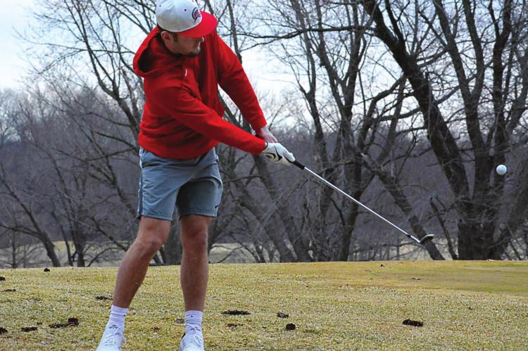 MOVING FROM the hardwood to the fairway, Richmond senior Collin Cromley works on his short game March 14 at Shirkey Golf Course. SHAWN RONEY | Staff