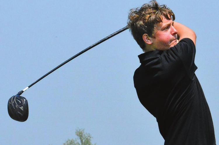 JACOB McELWEE of Orrick watches one of his drives during the Class 1 District 4 Tournament on Monday at Excelsior Springs Golf Course. SHAWN RONEY | Staff