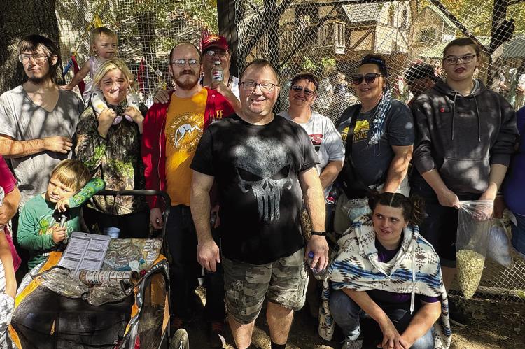 SPECIAL NEEDS SERVICES families enjoyed a day at the Kansas City Renaissance Festival thanks to tickets donated by the Richmond News. Shown here are James Abraham (back row, from left), Angelica Davis, Rosella Davis, Matt Pearon, Ryan Martin, Karen Park, Stephanie Hardwick, Dakota Treaster and Rebecca Smith. Also, Elvis Davis (front row, from left), Crystal Pearon, Jonathon Davis, Scott McCoy and Kristina Neilon. CAITLIN CROWLEY | Submitted