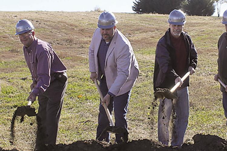 RAY COUNTY 911 Assistant Director Amanda Collins (from left), Director Kim Davis, Board Chairman Paul Harris, Board Treasurer Jimmy Carter, Board Member Pete Oulman, Board Member Perry Vandiver and Board Secretary Chad Burnine break ground on the new Ray County 911 Emergency Dispatch Center. MIRANDA JAMISON | Staff