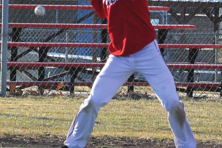 RICHMOND JUNIOR Josh Pyle, an infielder and a pitcher, takes an inside pitch during practice March 3 at Southview Park. SHAWN RONEY | Staff