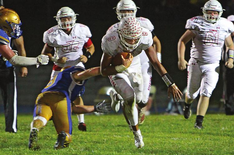 WHEN THE DEFENSE shuts down the passing game, Richmond quarterback Keyshaun Elliott runs. He picks up four TDs in the 54-34 win over Higginsville. J.C. VENTIMIGLIA | Staff
