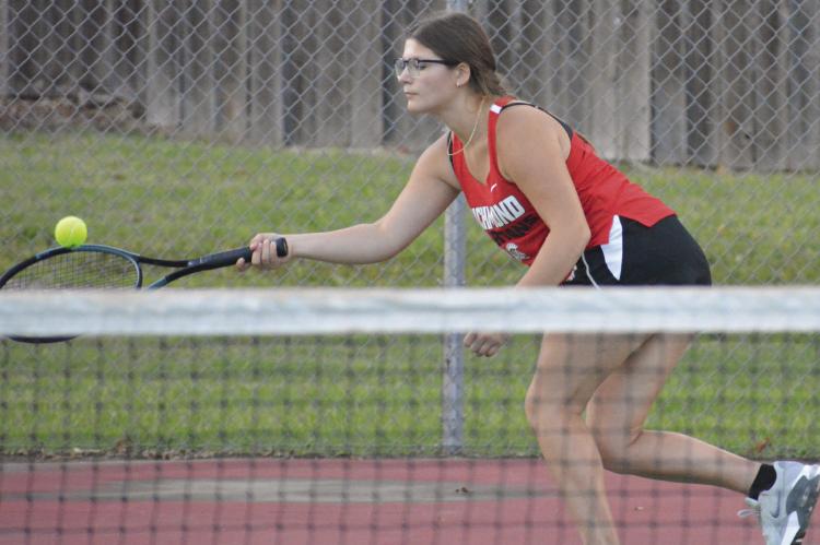 AVA BOZARTH stretches to attempt a forehand shot during Richmond’s Missouri River Valley Conference-East Division dual with Lexington. SHAWN RONEY | Staff