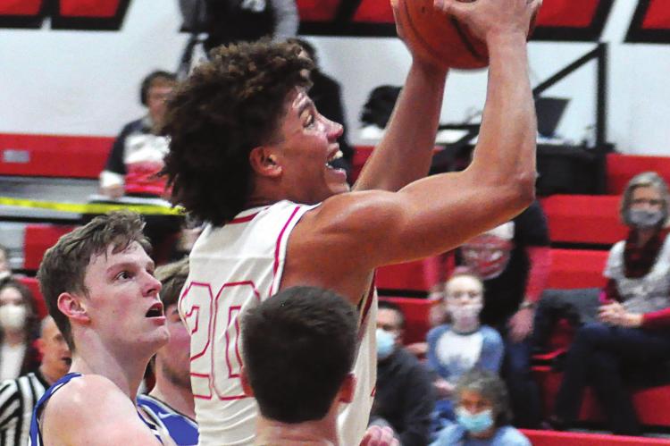KEYSHAUN ELLIOTT, No. 20, drives through Summit Christian Academy’s stingy defense to attempt a layup during the Spartans’ Jan. 29 meeting with the visiting Eagles for the Richmond Winter Classic boys title. SHAWN RONEY | Staff