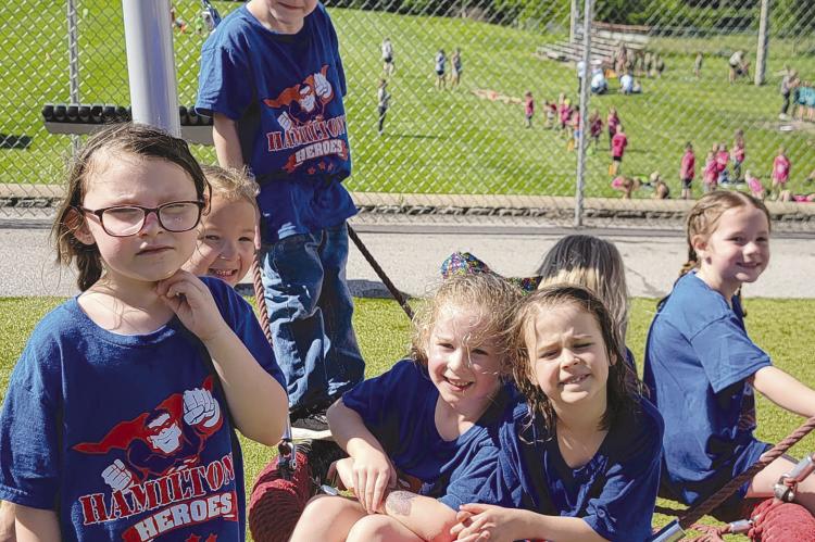 TAKING A BREAK on the Dear Elementary playground’s saucer swing are Elena Graham (from left), Charli Dunwoodie, Nora Higgins, Kylea Covey, Wyatt Rosenbalm and Sutton Hyder. DIANA SHULL | Staff