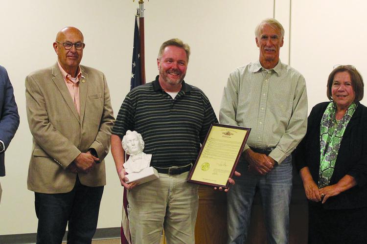 JIMMY CARTER (from left), State Representative Terry Thompson, Rob Swafford, John Letzig, Shelia Bridges and Princess Coughlin celebrate this year’s David Whitmer award winner. SHARON DONAT | Staff