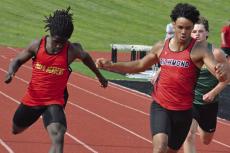 MALIKIAH THARP (right), shown running in the 200-meter dash at districts, looks to be a state champion in 2027 after posting four runner-up finishes at the 2026 Class 3 meet, including two relay races. SHAWN RONEY | Staff