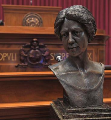 THIS BRONZE BUST of Annie White Baxter, the nation’s and Missouri’s first female county clerk, is viewed in the House chamber. The bust has since been placed on display in the Capitol Rotunda’s Hall of Famous Missourians. TIM BROMMEL | House Communications