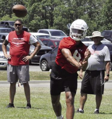 KEYSHAUN ELLIOTT, shown passing during 7-on-7 scrimmaging in July 2019 as part of his duties as Richmond’s varsity quarterback, will soon appear in his second straight bowl game with New Mexico State University. However, he’ll play on defense when the Aggies face Fresno (Calif.) State University Dec. 16 in the New Mexico Bowl SHAWN RONEY | Staff