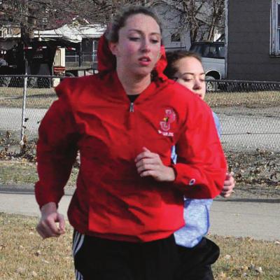 CARLY THACKER, seen training March 5 in her red windbreaker, hopes to have the chance to defend her Class 1 state girls 300-meter low hurdles title.