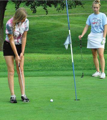 HANNAH NORRIS practices her putting Aug. 14 at Shirkey Golf Course. SHAWN RONEY | Staff