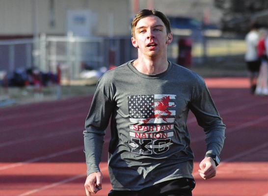 RICHMOND SENIOR Jude Rumbaugh trains March 5 on the high school track, looking to “try to get back into the feel of running again.” SHAWN RONEY | Staff