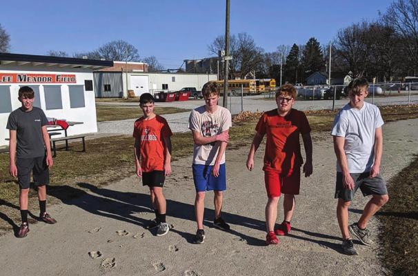 KIRK THACKER’S Hardin-Central varsity boys team enjoys some early March weather and gets some training work done on the school track. KIRK THACKER | Submitted Photo