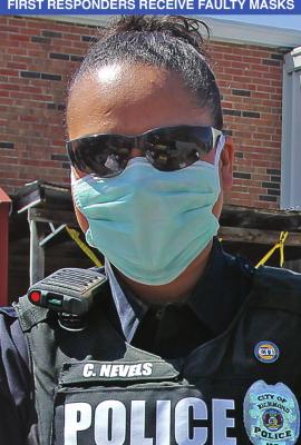 RICHMOND Police Officer Chassity Nevels wears a facemask to give out commodities. Masks are expected to help keep wearers from transmitting or being infected by COVID-19, but the state sent emergency management agencies faulty masks. J.C. VENTIMIGLIA | Staff