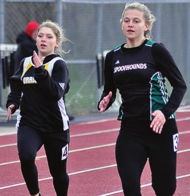 KIRRA VAUGHN, left, pushes herself during the girls 200-meter dash. SHAWN RONEy | Staff
