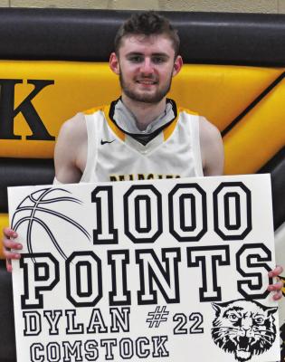 ORRICK SENIOR Dylan Comstock enjoys achieving a career milestone Tuesday after the Bearcats’ 64- 41 Class 1 District 13 Tournament victory over visiting Norborne. SHAWN RONEY | Staff