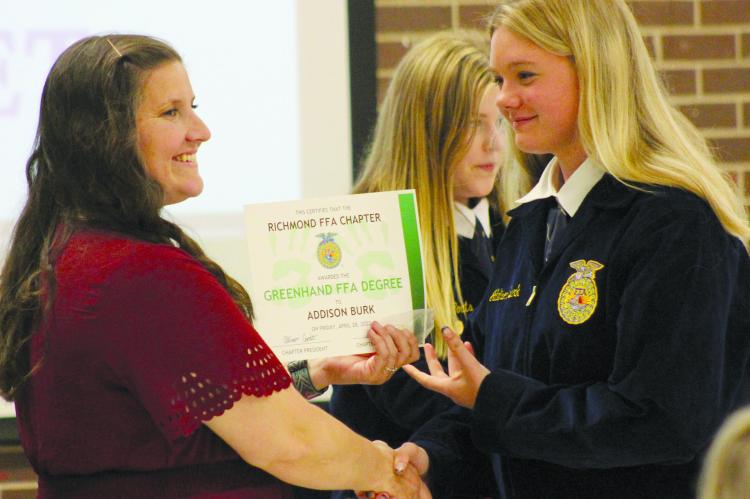 ADDISON BURK (RIGHT) receives her greenhand degree from FFA advisor Laura Allen. See story and photos on page 6. SOPHIA BALES | Staff
