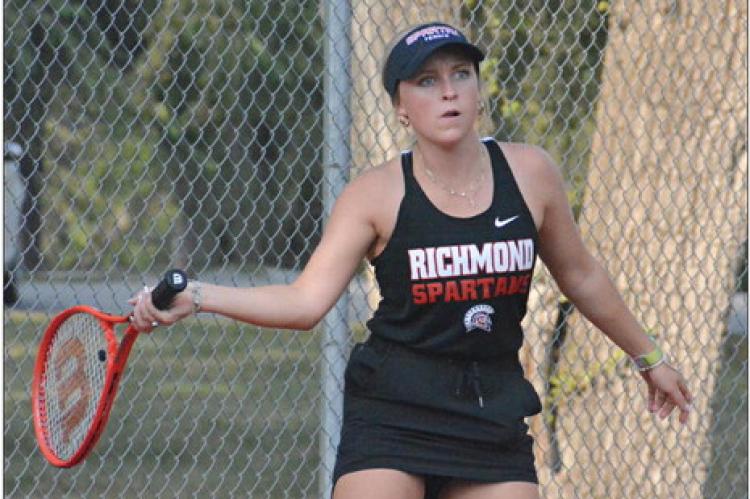 SENIOR HAILEE GREEN keeps her eye on the ball as she prepares to hit a return show during Richmond’s Sept. 21 Senior Night dual with Lexington at Maurice Roberts Park.