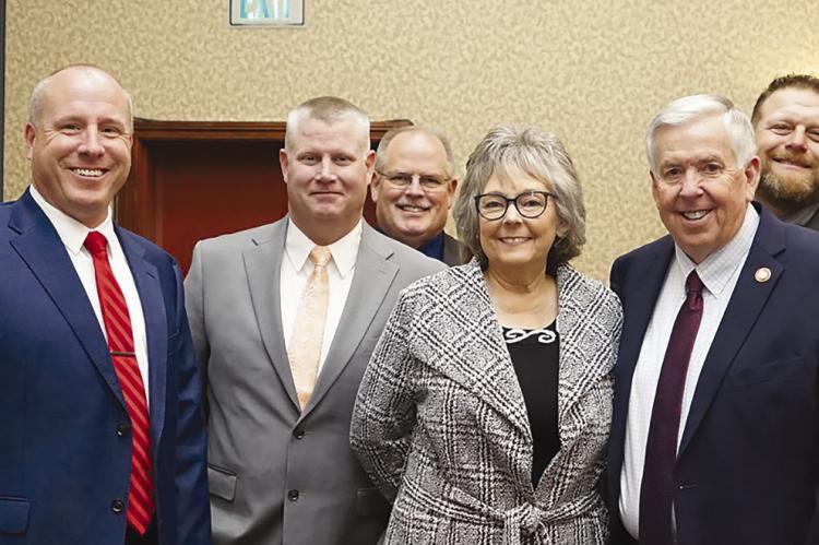 DANIEL PETET (from left), Terry Thompson, Michael Stephenson, Billy Gaines, Willie Isaacson, Peggy McGaugh, Mike Parson, Jeremy Greer, Ross Greer and Cooper Greer meet and greet in Jefferson City. Submitted