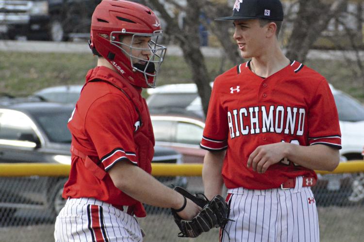 SENIOR CATCHER Aidan Ivison chats with southpaw pitcher Leyton Lee during the Spartans’ red-and-white preseason scrimmage March 15 at Southview Park in Richmond. SHAWN RONEY | Staff