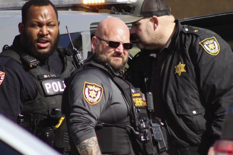 RICHMOND POLICE Officer Romulus Davis (from left), Ray County Sheriff Deputy Brian Lackey and Ray County Sheriff Scott Childers assist in the arrest of Brenden Parsons. SOPHIA BALES | Staff