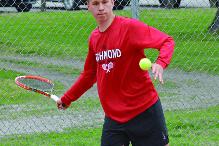 FELIX DE HESSELLE waits to hit a forehand shot during Richmond’s April 27 Missouri River Valley Conference East Division dual with Carrollton at Maurice Roberts Park. SHAWN RONEY | Staff