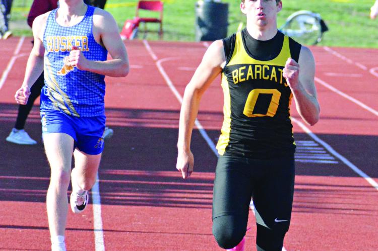 ORRICK SOPHOMORE Jeff Rohde looks to finish strong and fight off a challenge on his right during his heat of the boys 400-meter dash at the Bruce Finlayson Invitational April 21 at Carrollton. SHAWN RONEY | Staff