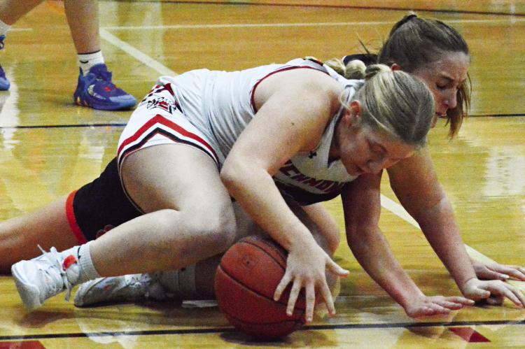 SENIOR HAYLEE WEBER keeps a firm hand on the basketball Tuesday night during Richmond’s 46-33 victory over Oak Grove in the Richmond Winter Classic. SHAWN RONEY | Staff