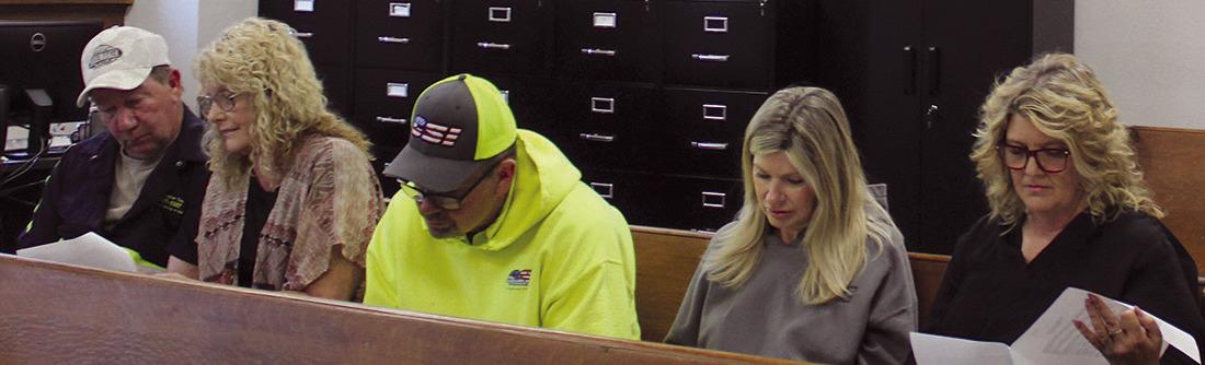 TOWING OPERATORS and county officials review a proposed towing resolution during a lengthy discussion about dispatch rotations, response times and business-location requirements for towing companies operating in the county. MIRANDA JAMISON | Staff
