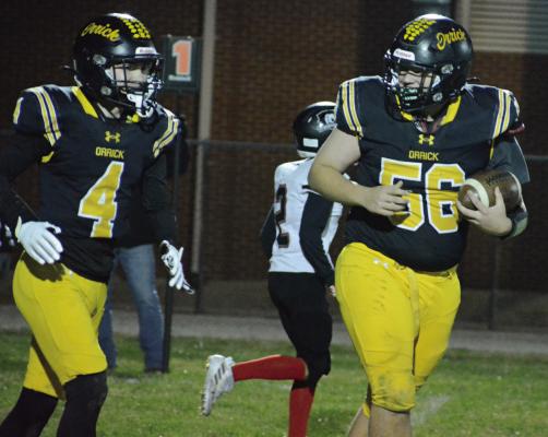 ORRICK JUNIOR Reese McCartney (left) gives a look to teammate Levi Fielder after catching a two-point conversion pass late in the Bearcats’ district victory over Northland Christian. SHAWN RONEY | Staff