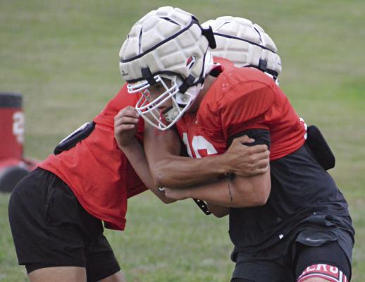 THE SPARTANS drill to prepare for their meeting with Knob Noster in varsity 11-man football. SHAWN RONEY | Staff
