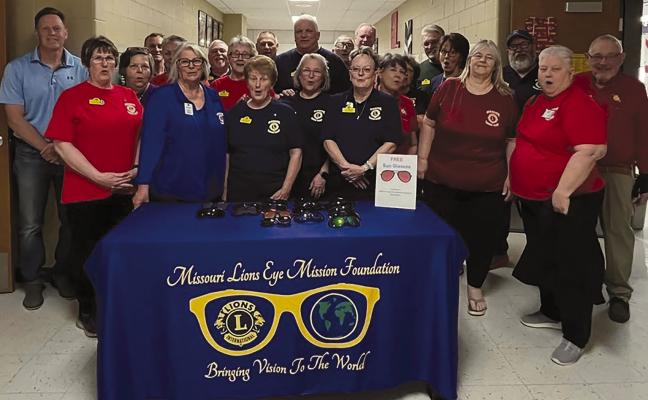 MEMBERS OF THE Lions Club from Orrick, Maryville, St. Louis and Independence gather to commemorate the conclusion of a successful eye clinic that served 75 members of the community. Submitted