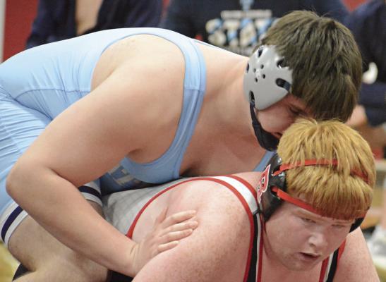 LANDON GARRETT of Richmond looks to get up from the bottom position during his match with Archer Cavanah of Father Tolton Regional Catholic. SHAWN RONEY | Staff