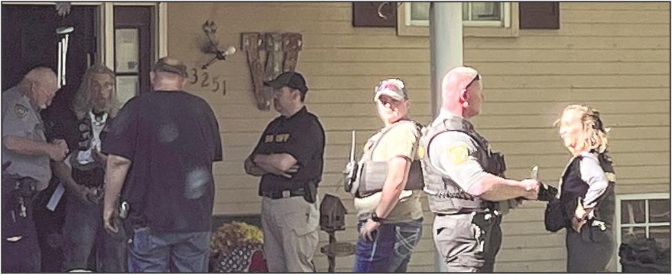 Ray County Sheriff’s Department Deputy Ray Orth (from left), Criminal James Woodruff Sr., Sheriff Scott Childers, Mental Health Deputy Mason Lumpkins, Detective Celeste Kaiser, Deputy Shannon Case and Lieutenant Amy Sisson responded to a call regarding Woodruff. SOPHIA BALES | Staff