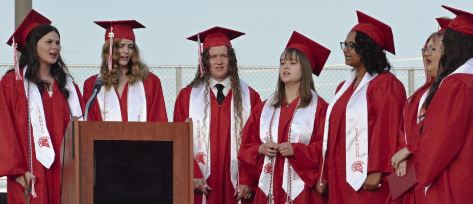 THE SENIOR members of the choir sing the school song. SHAWN RONEY | Staff