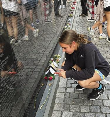 ADDISON BECK reads names of the fallen at the Vietnam War Memorial. BRENDA HAMM | Submitted