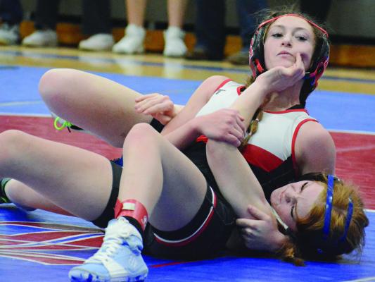 A FIRST-ROW bleacher seat works fine to capture action on the mat. SHAWN RONEY | Staff