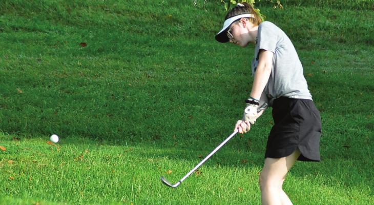 JUNIOR TORI BOWMAN works on her chip shot as she and her fellow Spartans wrap up their first week of girls golf practice Aug. 14 at Shirkey Golf Course in Richmond. SHAWN RONEY | Staff