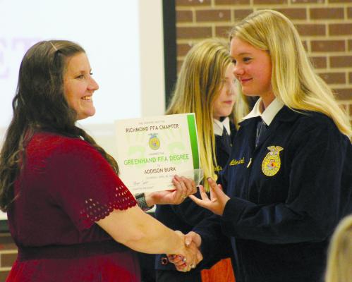 ADDISON BURK (RIGHT) receives her greenhand degree from FFA advisor Laura Allen. See story and photos on page 6. SOPHIA BALES | Staff
