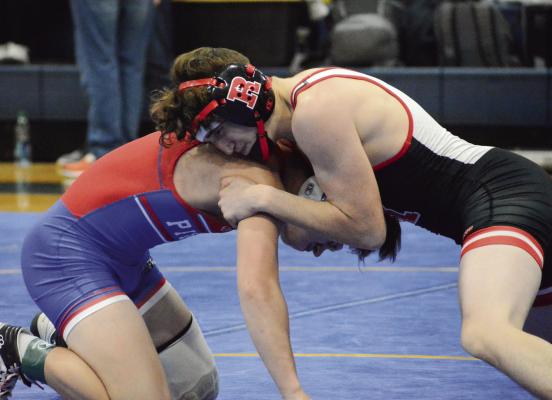 WRESTLING FROM the top position, Richmond junior Declan Cockrum works to break down California’s Patrick Morrow in the 120-pound fifth-place match at the Highway 13 Throwdown, hosted Jan. 28 by Lafayette County. SHAWN RONEY | Staff